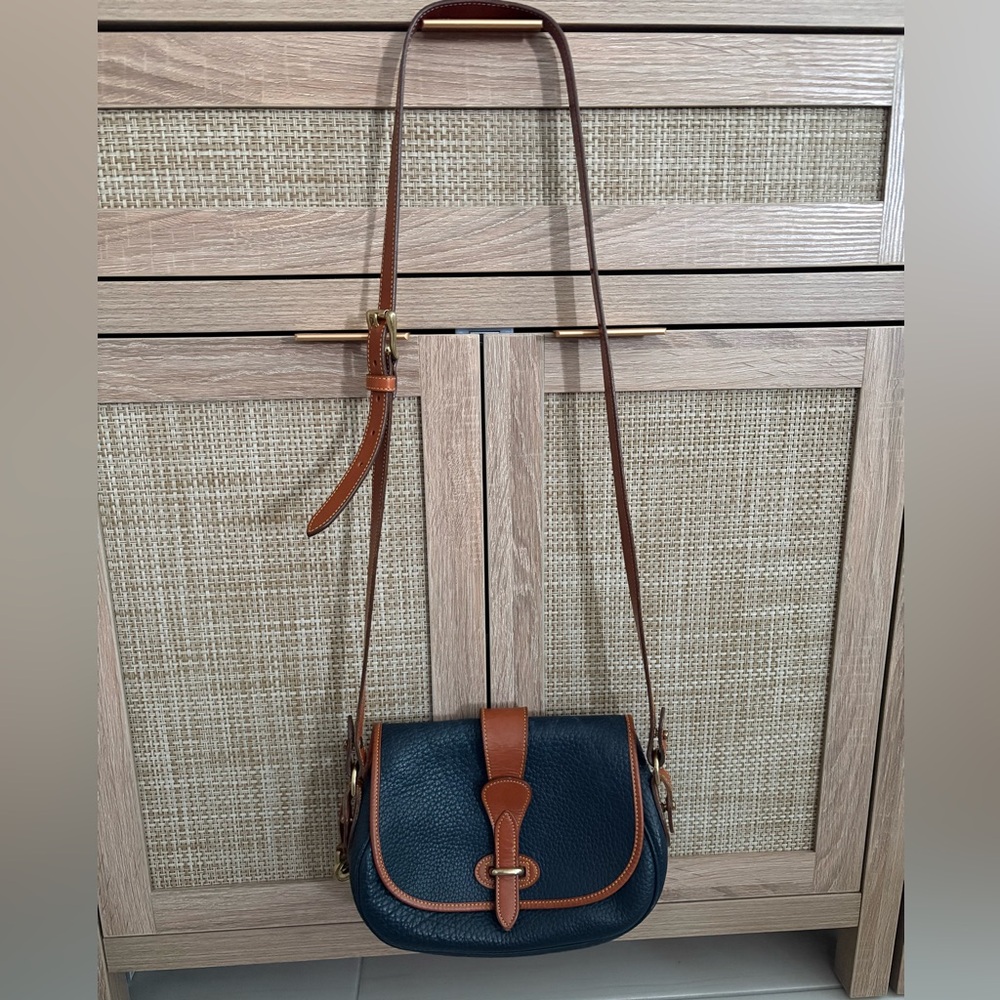 Classic Pebble Leather Saddle Crossbody Bag in Navy and Brown Dooney and Bourke
